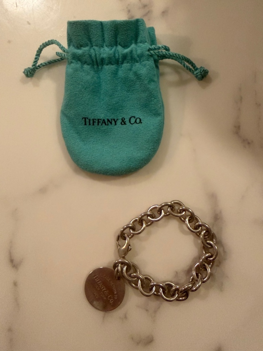 Tiffany  Return to Tiffany’s round-tag charm bracelet